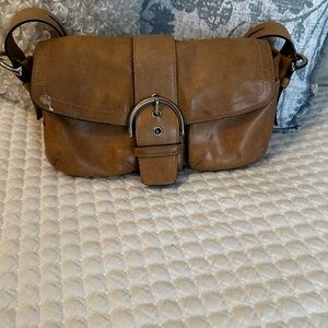 Coach Tan Crossbody Bag with Suede Finish and Buckle Closure